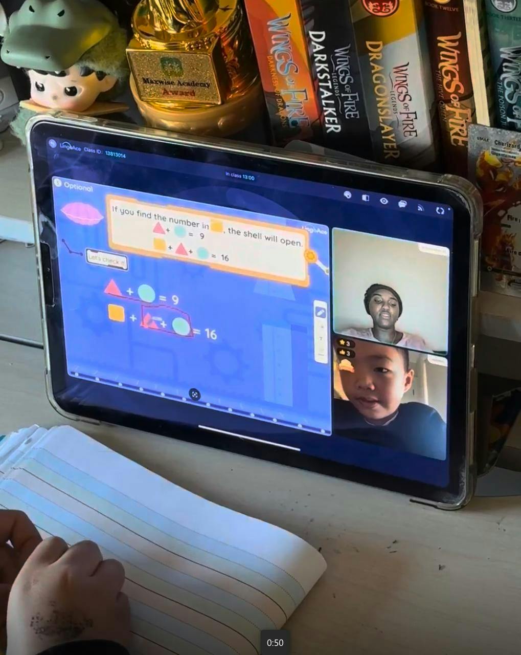 Child participating in a remote learning session on a tablet with a teacher