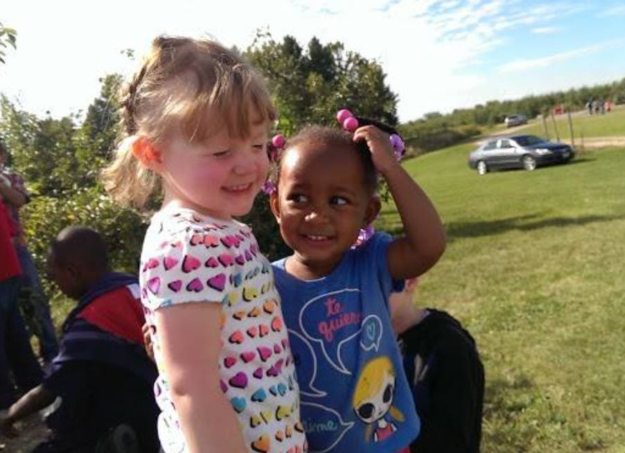 Two children standing outdoors
