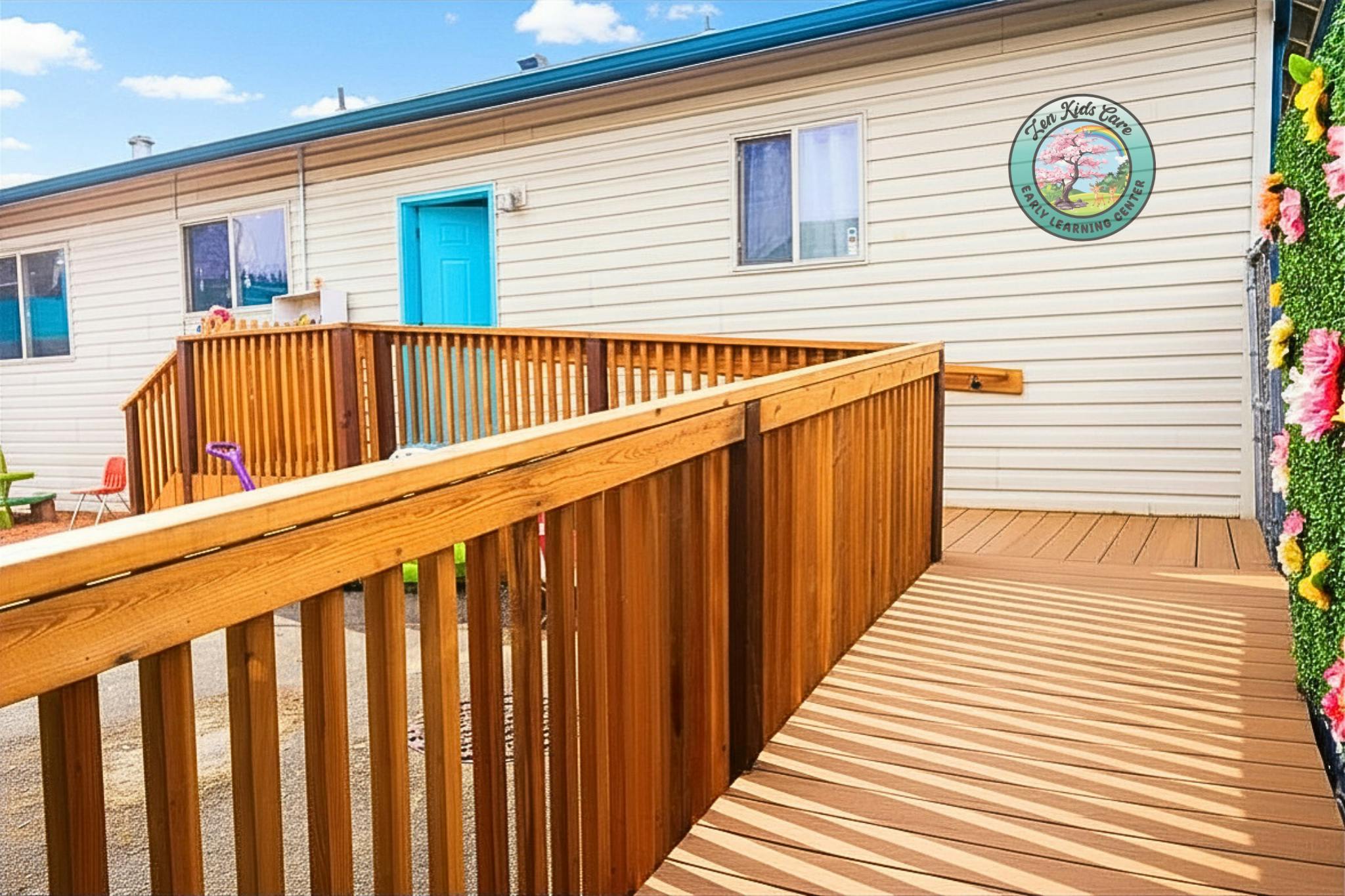 Exterior of an early learning center with a ramp leading to a blue door