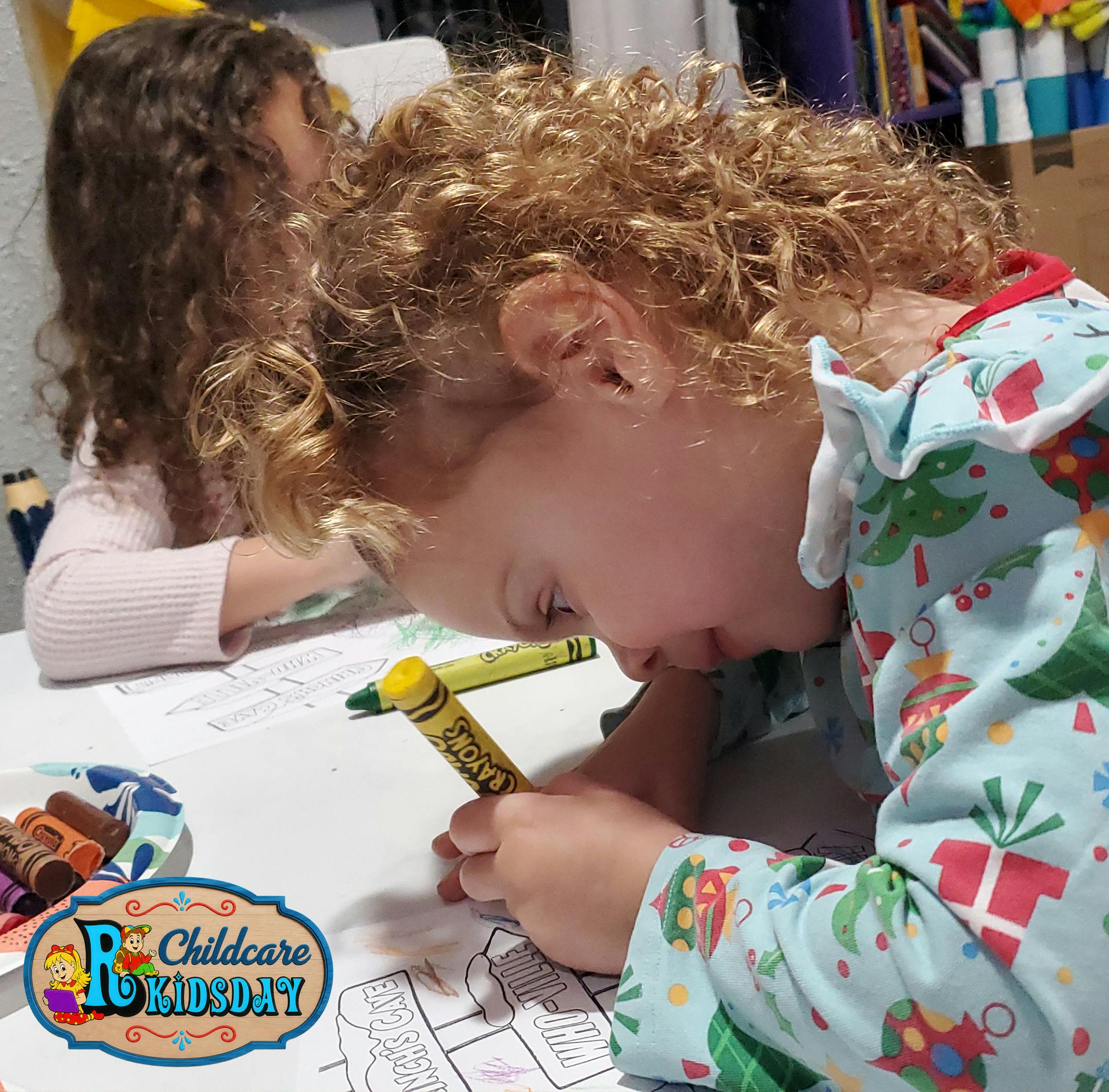 Two children coloring at a table