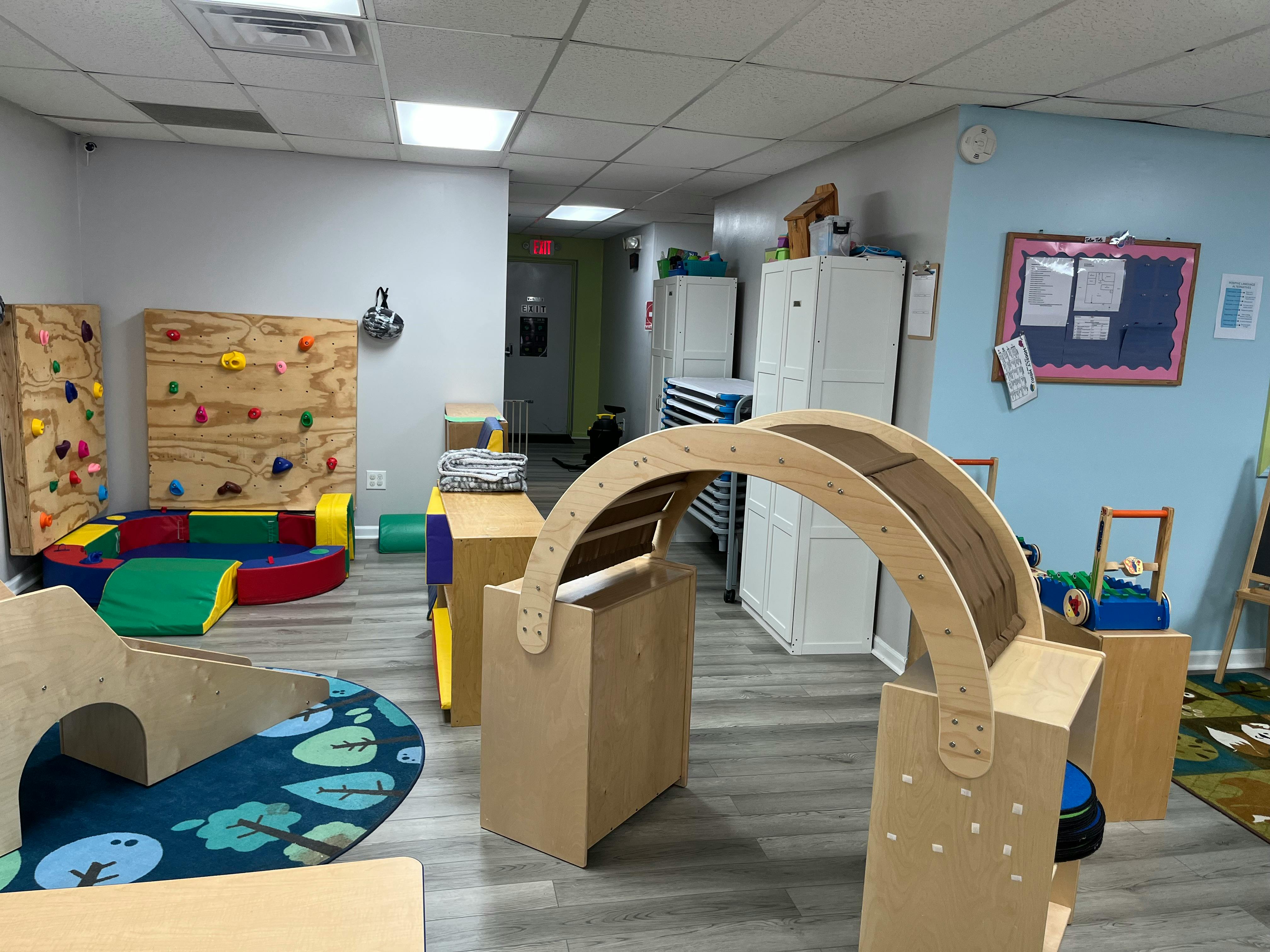 Indoor play area with climbing walls and soft play equipment