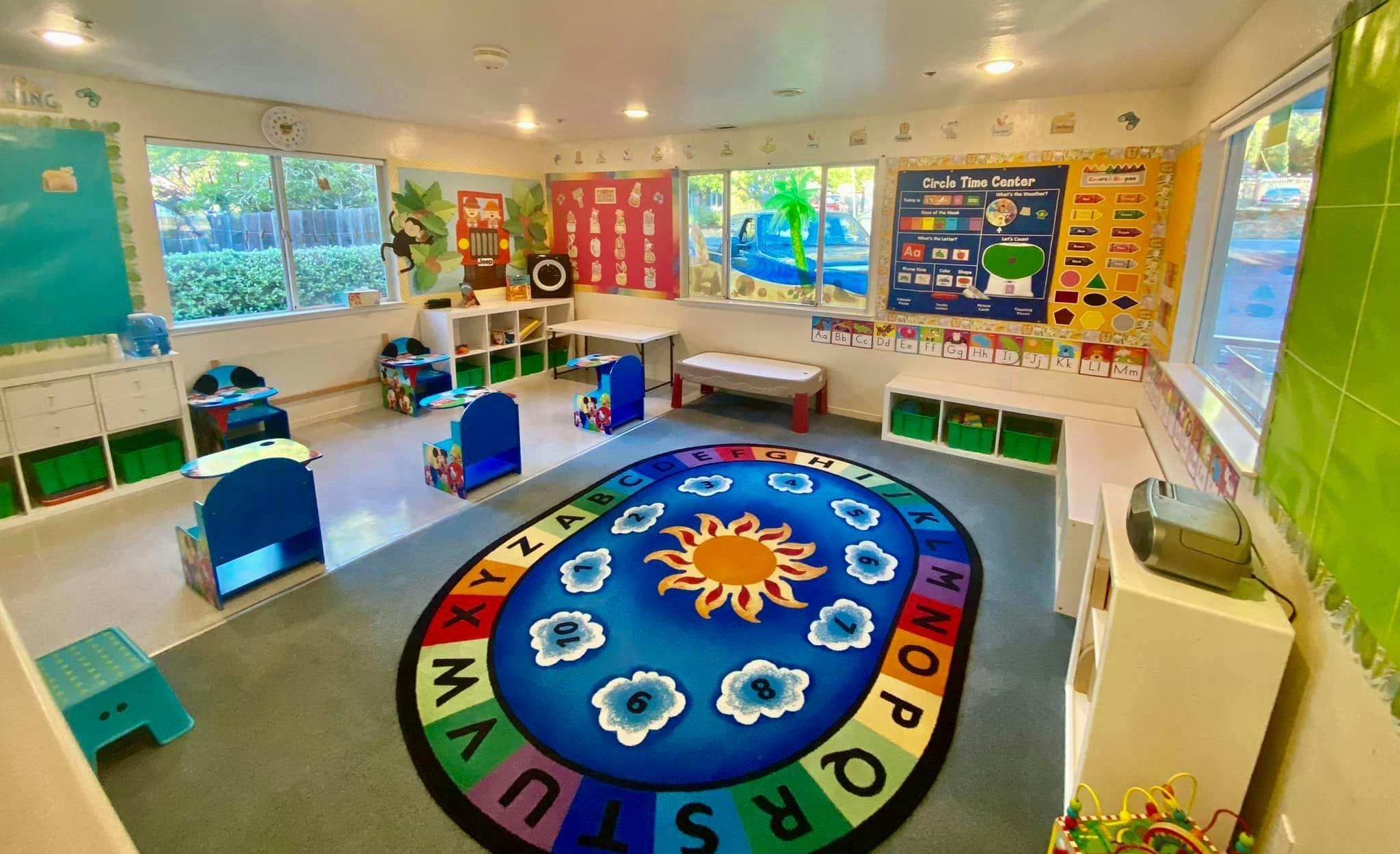 Classroom with a large alphabet rug in the center