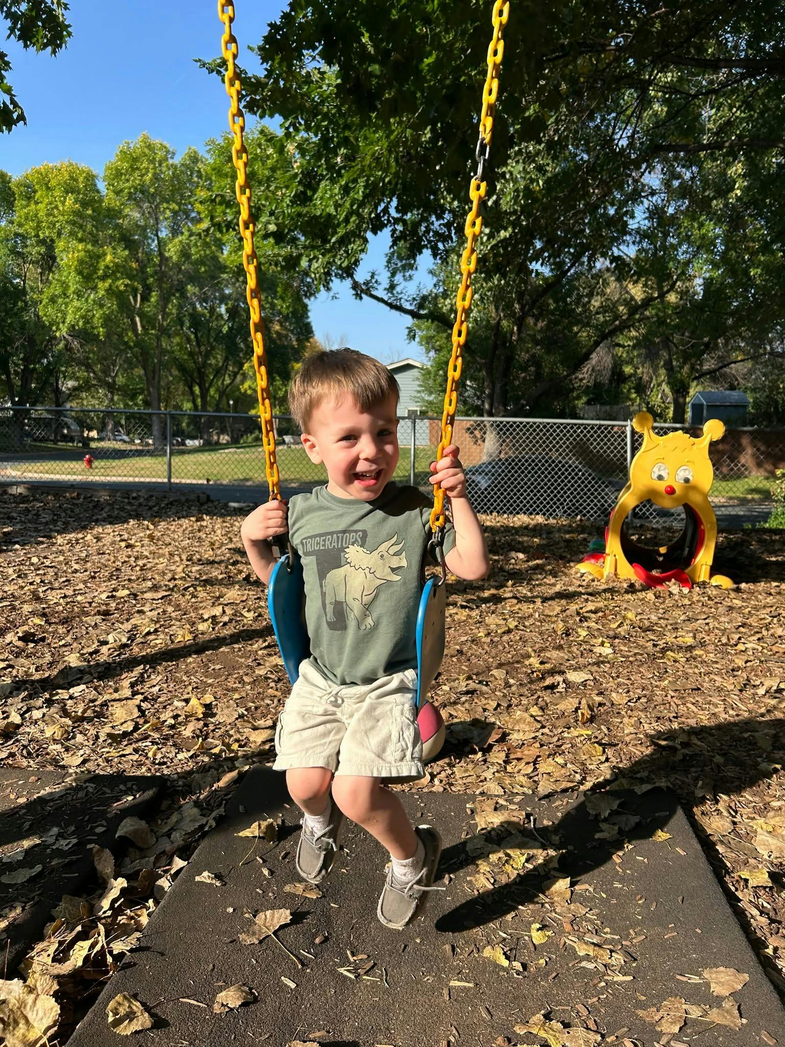 Child swinging on a playground swing