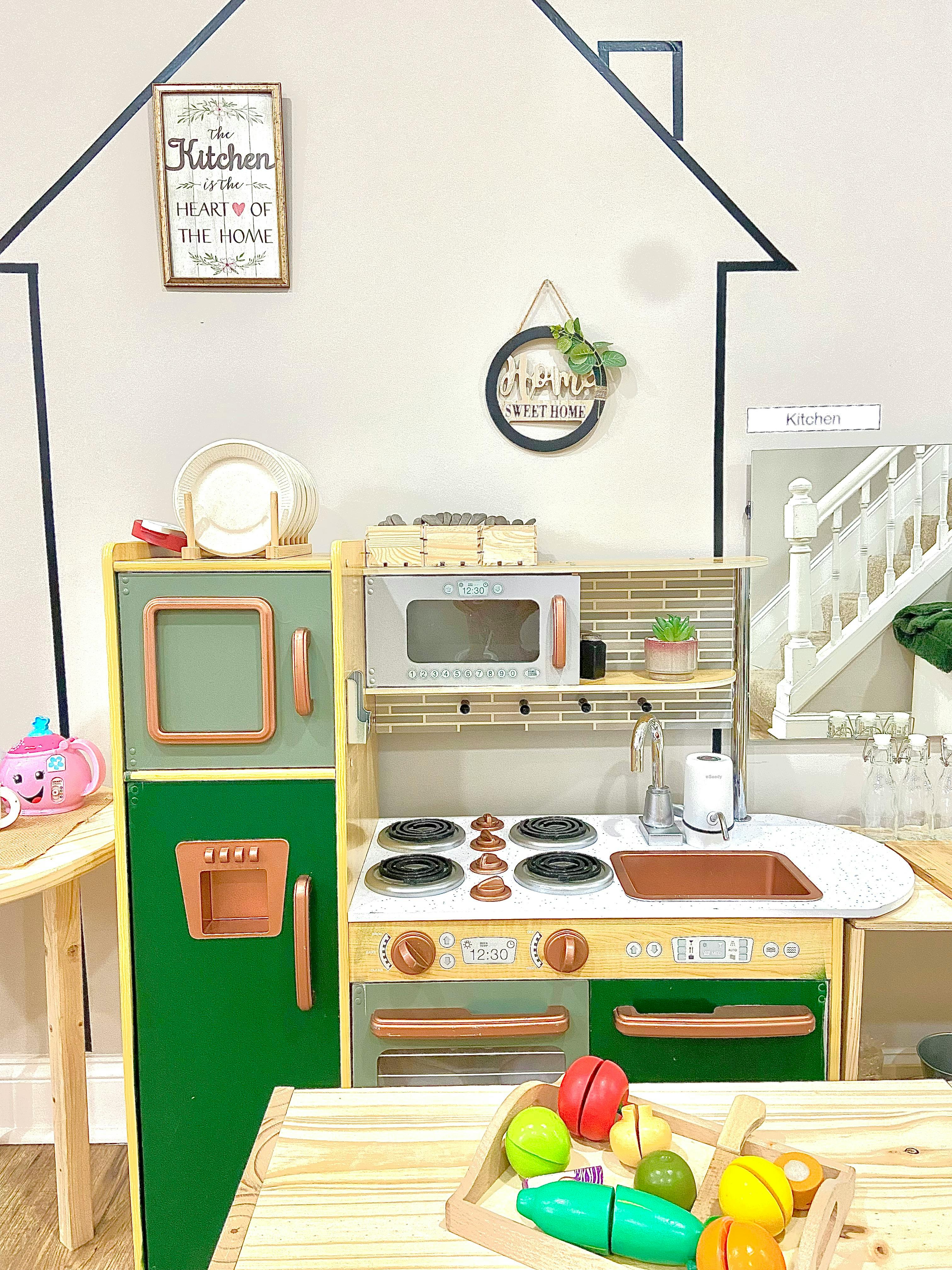 Child's play kitchen with toy food