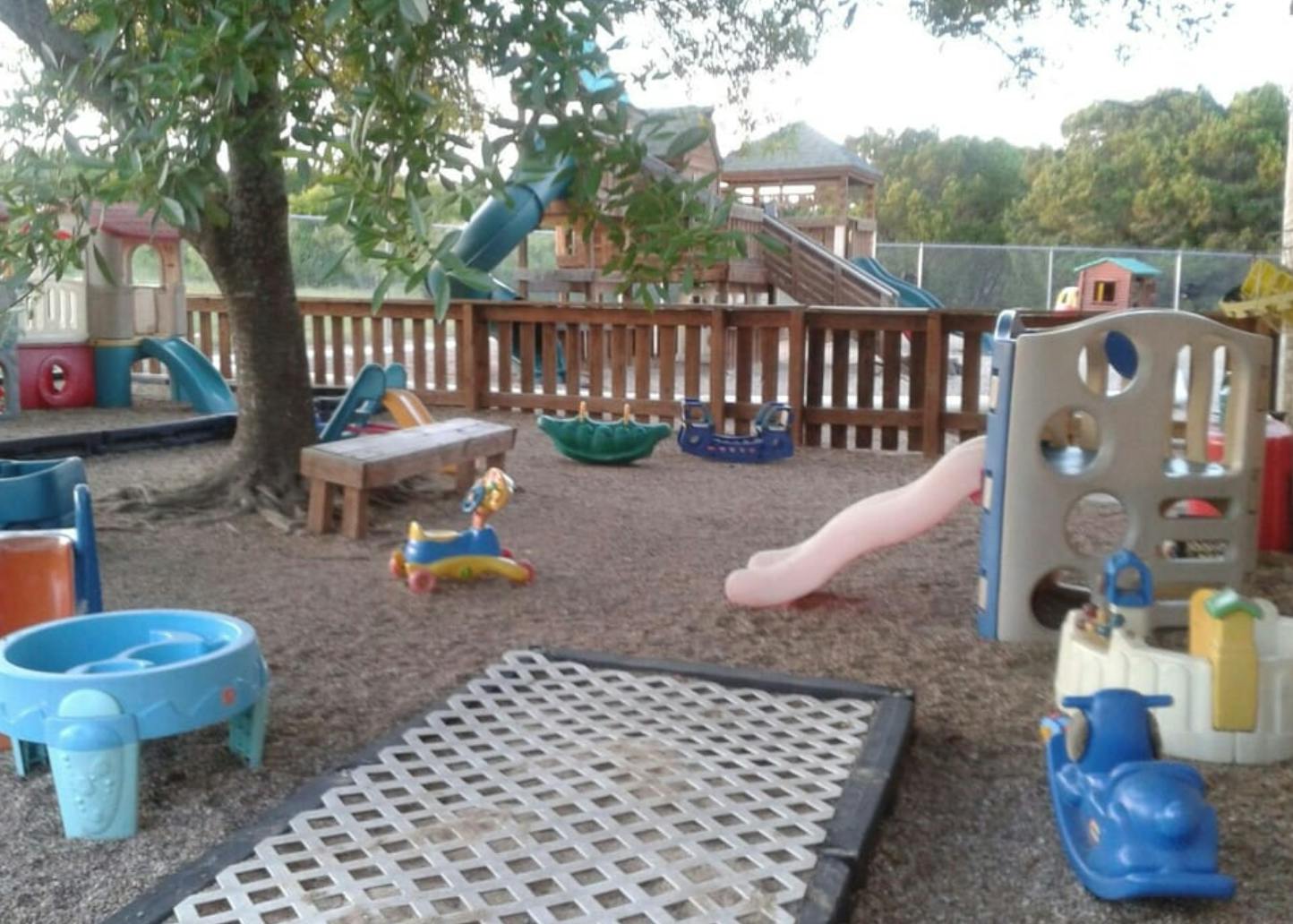 Outdoor playground with various play structures and toys