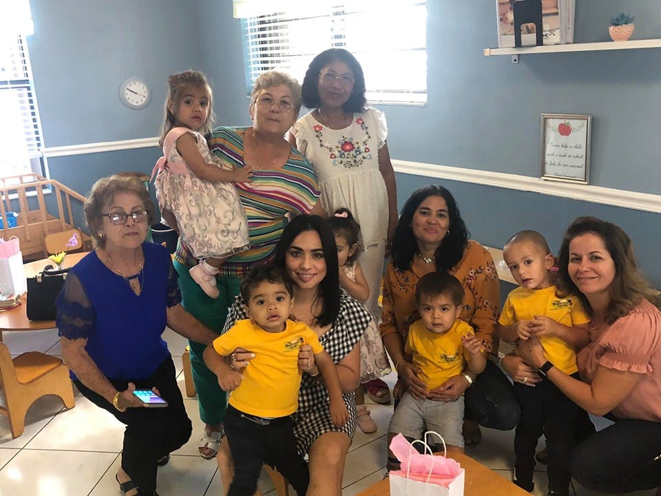Group of women and children posing indoors