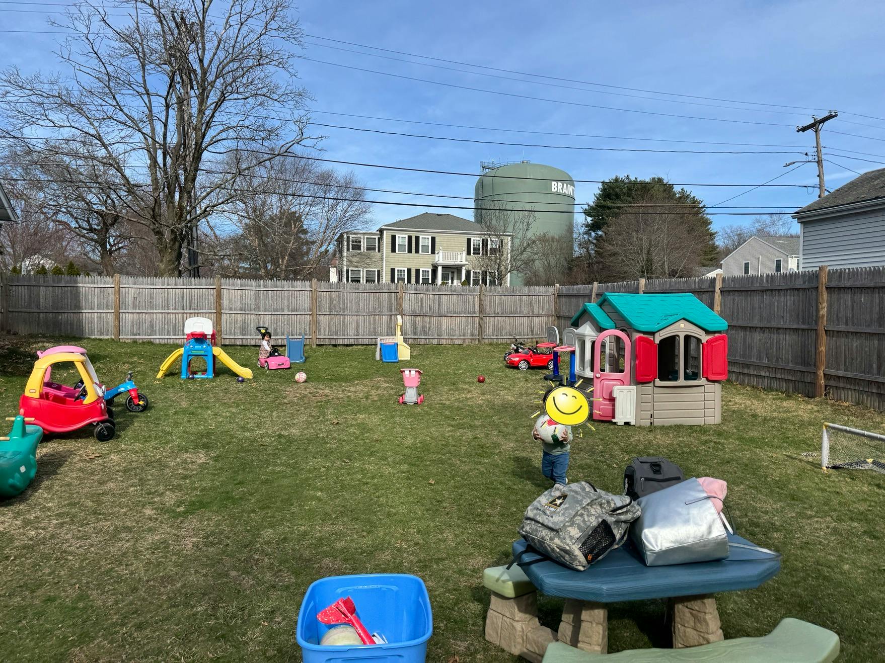 Backyard with various children's play equipment