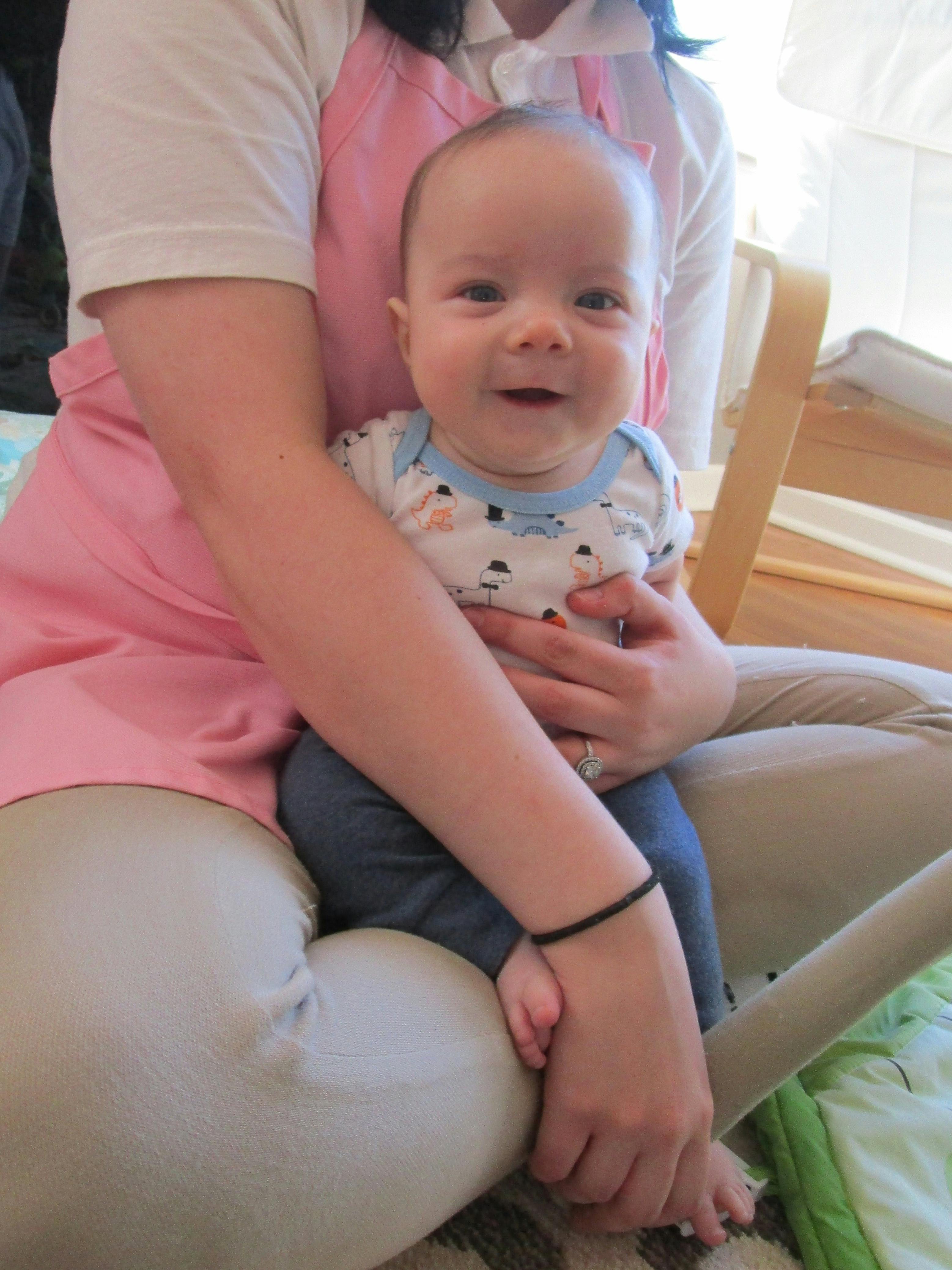 Person holding a smiling child