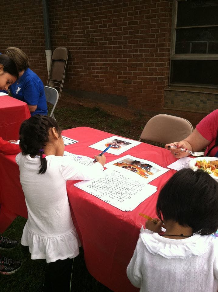 Children drawing and coloring at a table