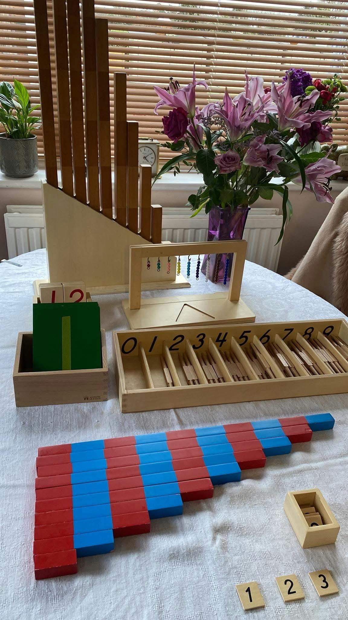 Montessori math materials including number rods, bead chains, and number blocks