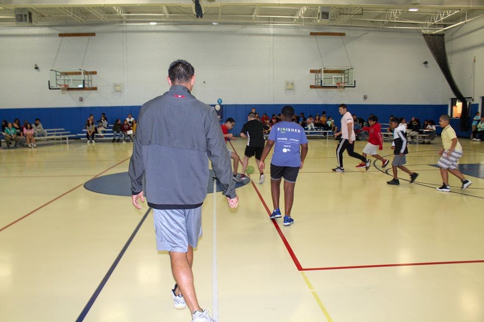 People playing on a gymnasium court
