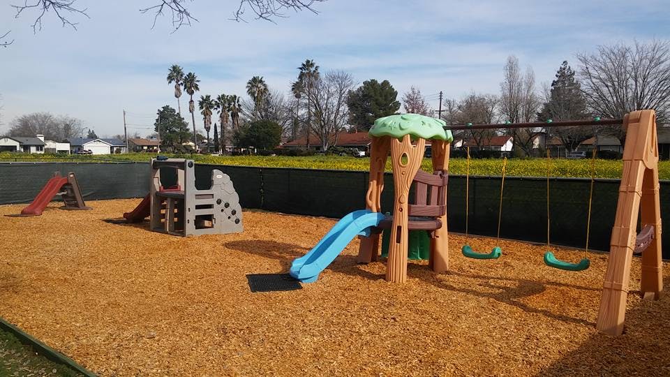 Empty playground with slides and swings