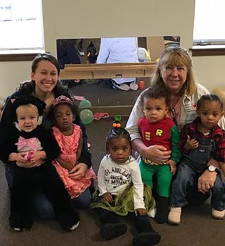 Two adults and five children posing for a photo