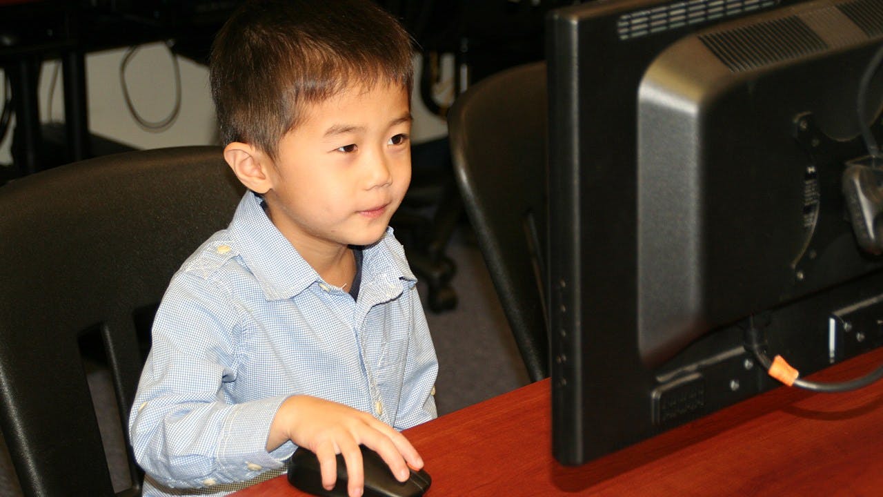 Child using a computer mouse