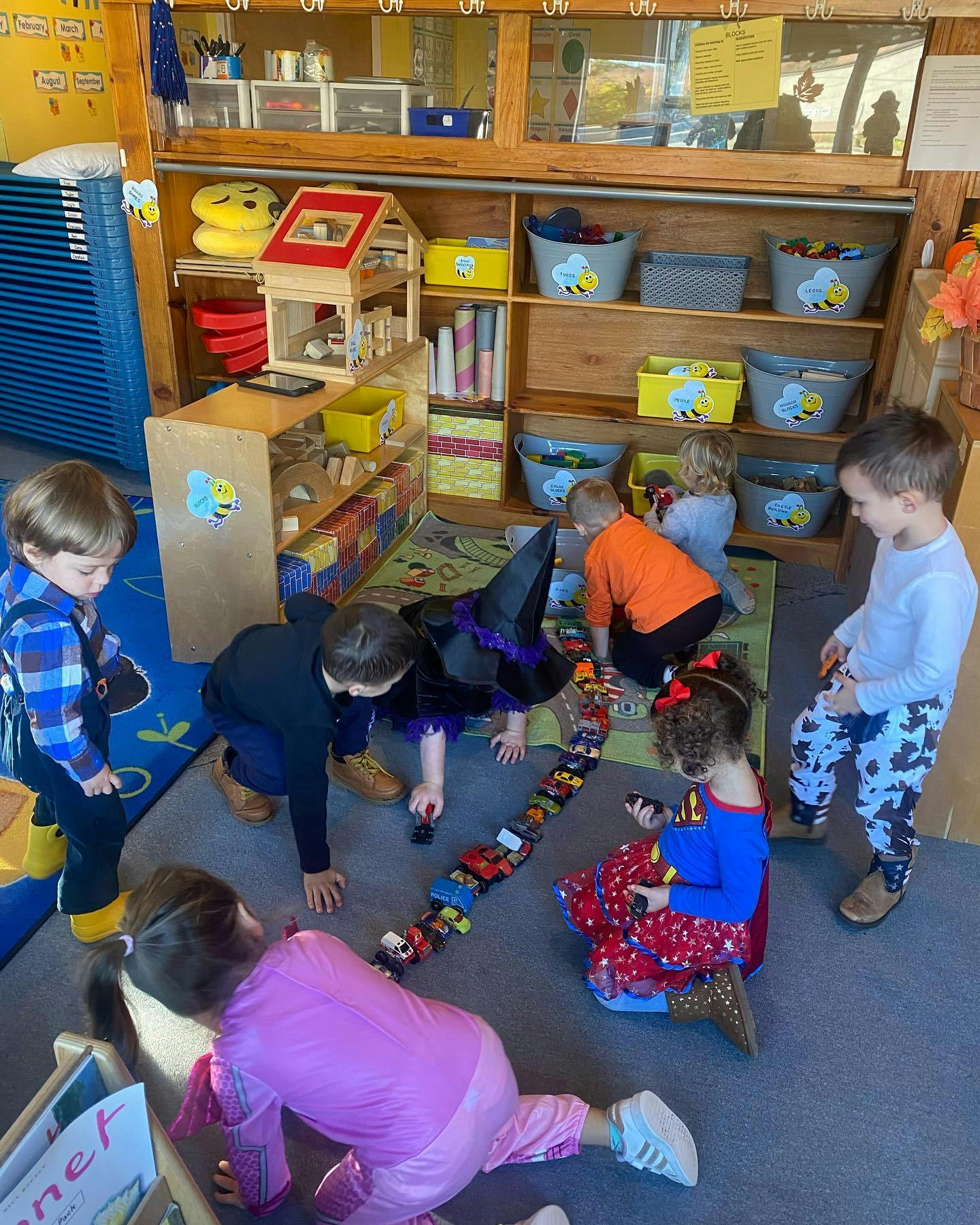Children playing with toys on the floor