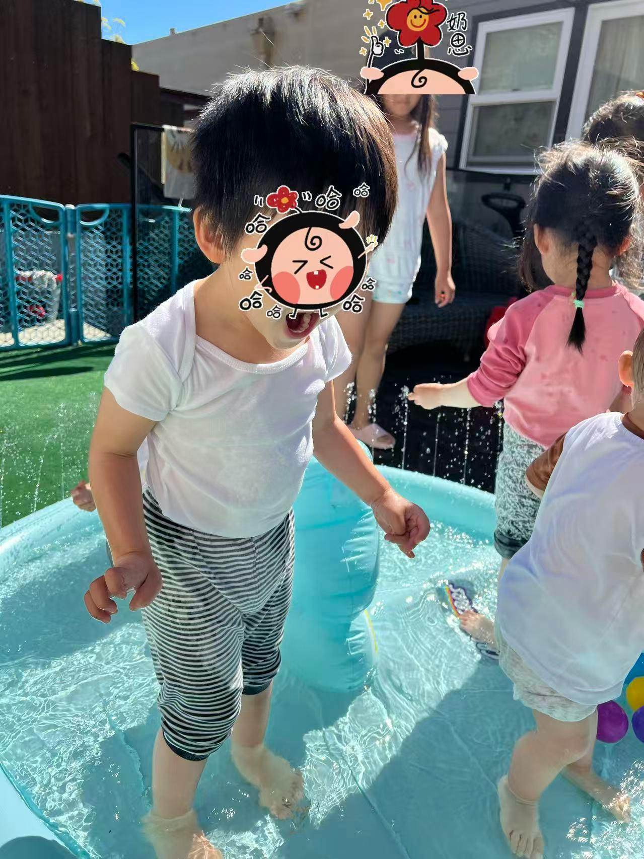 Child standing in a small inflatable pool with other children