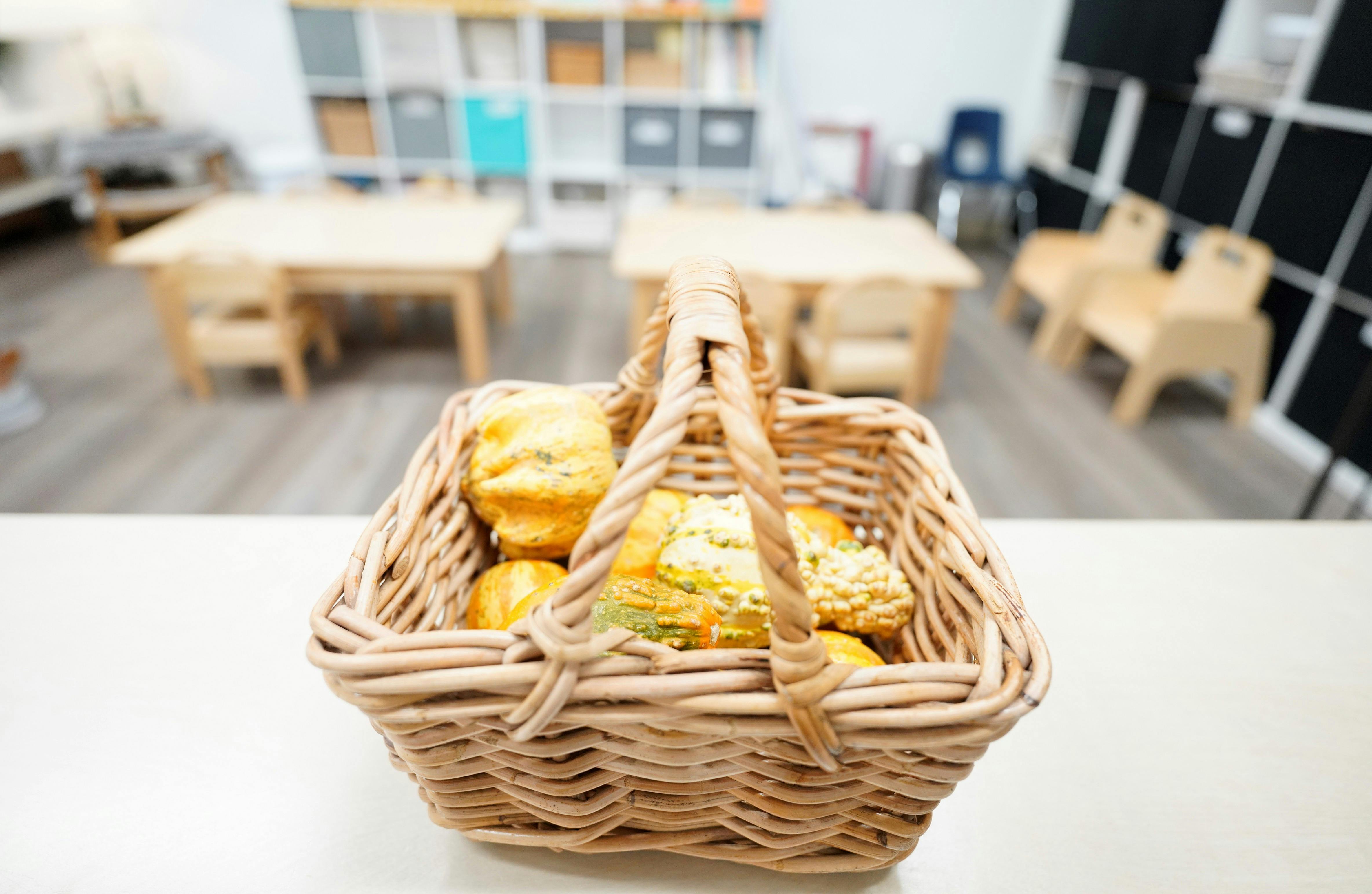 Wicker basket filled with baked goods in a classroom
