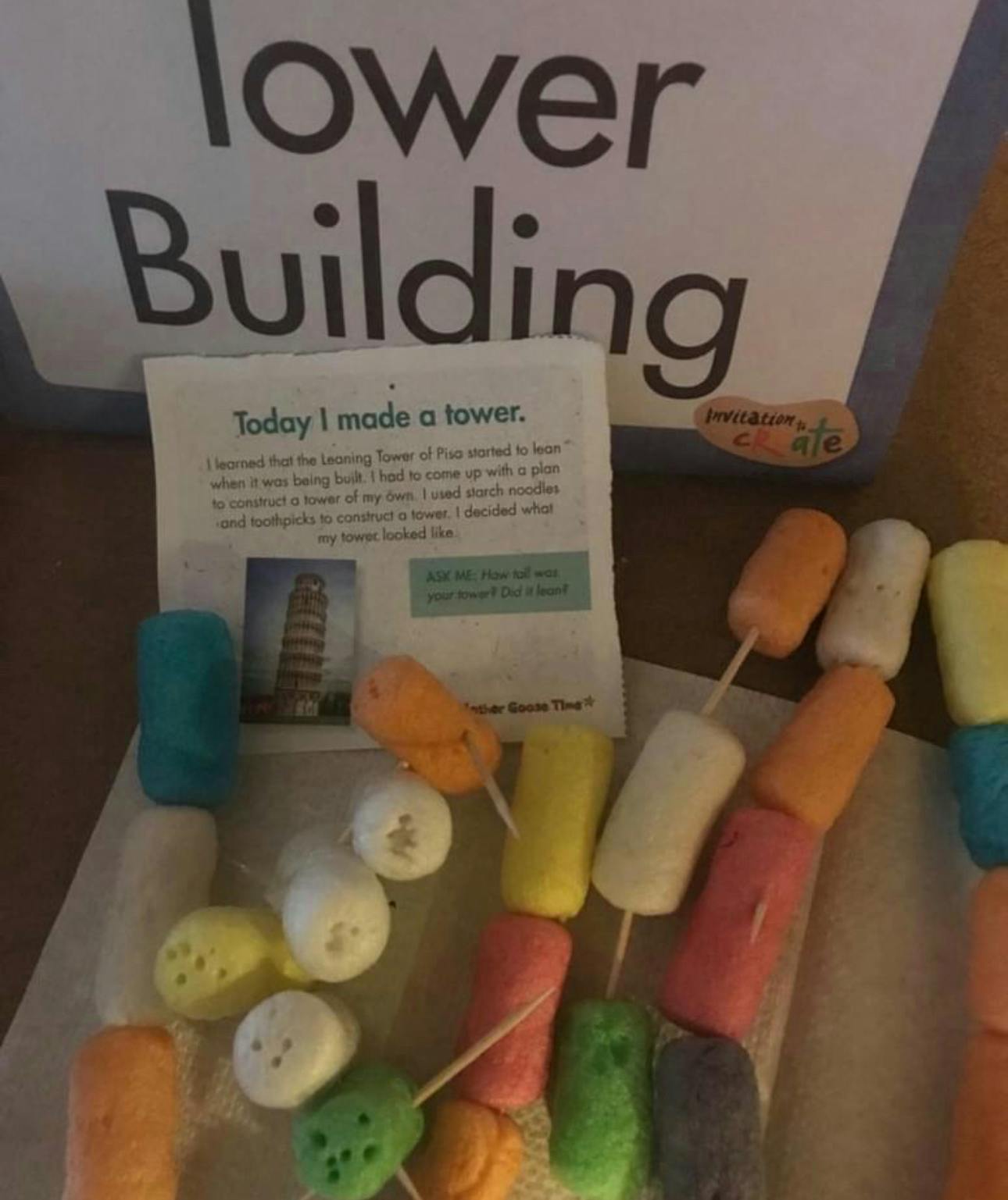 Colorful marshmallows on skewers with a sign that reads "Tower Building"
