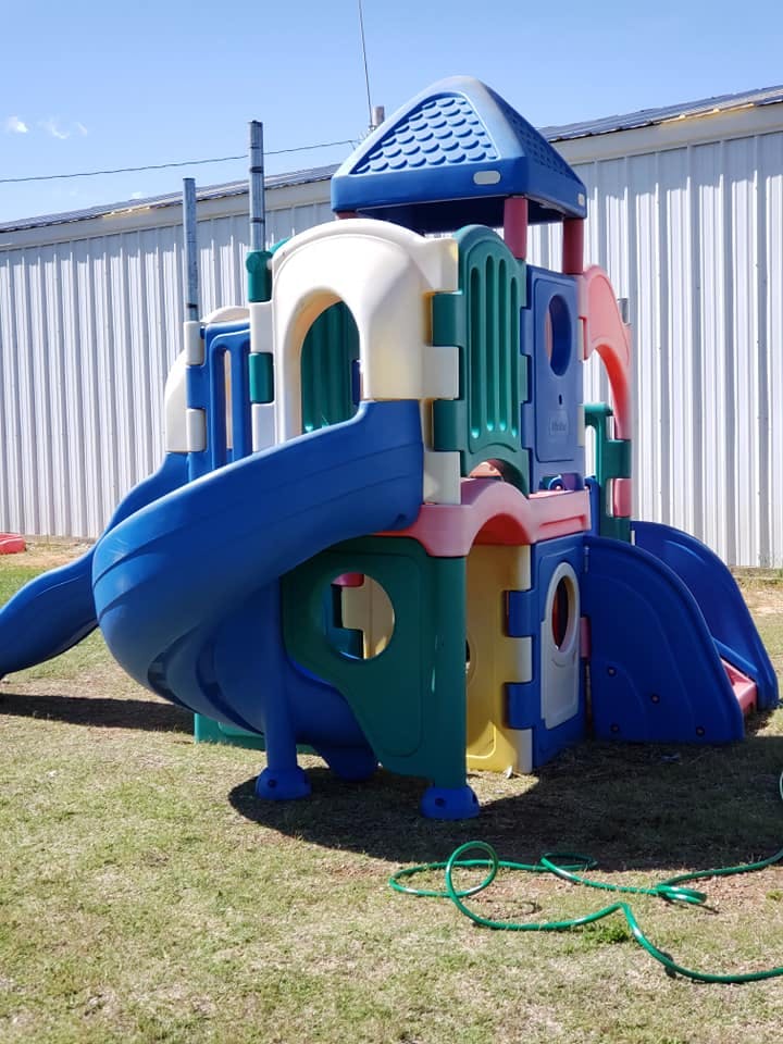 Colorful playground structure with slides and tunnels
