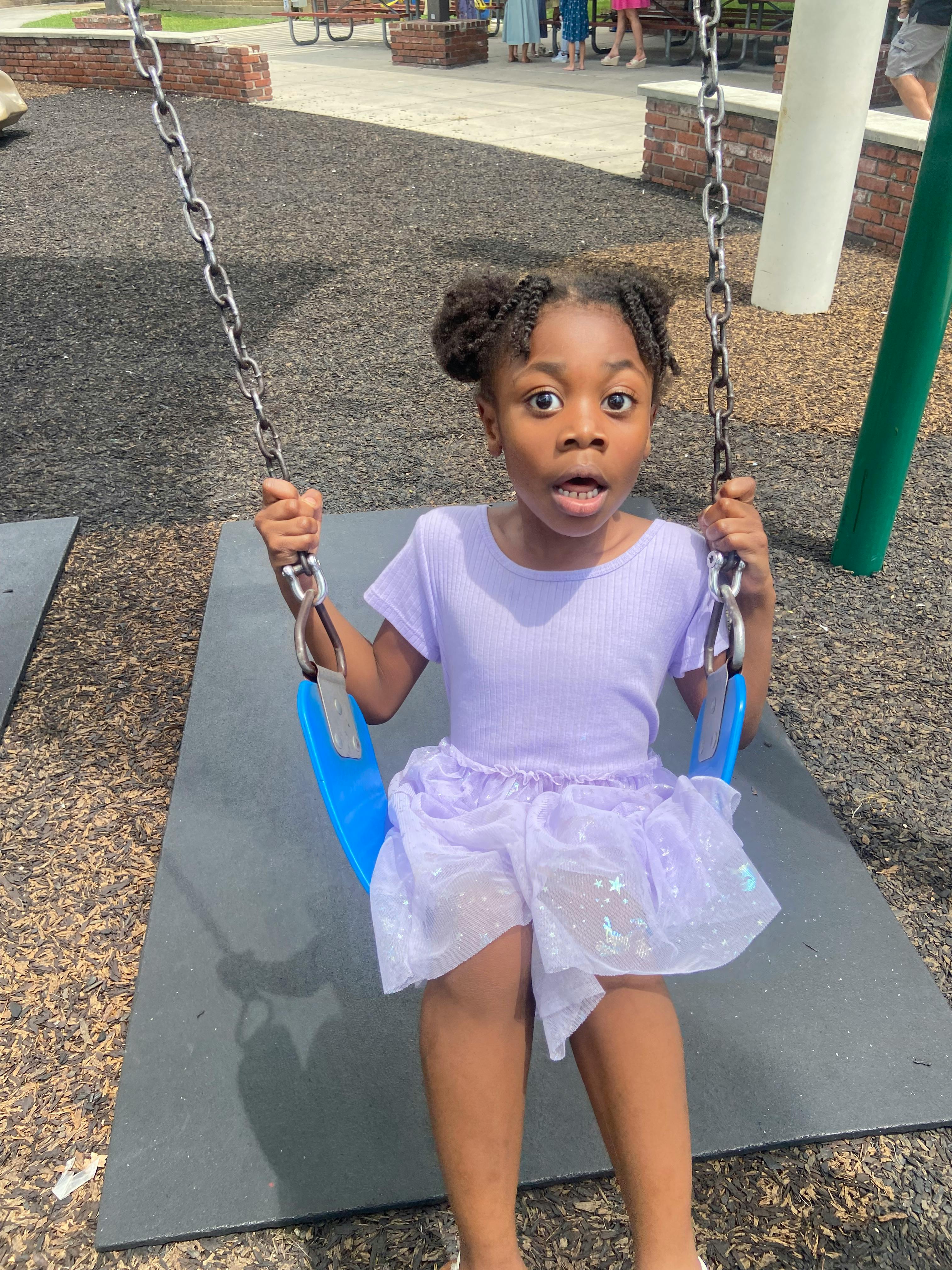 Child on a swing at a playground