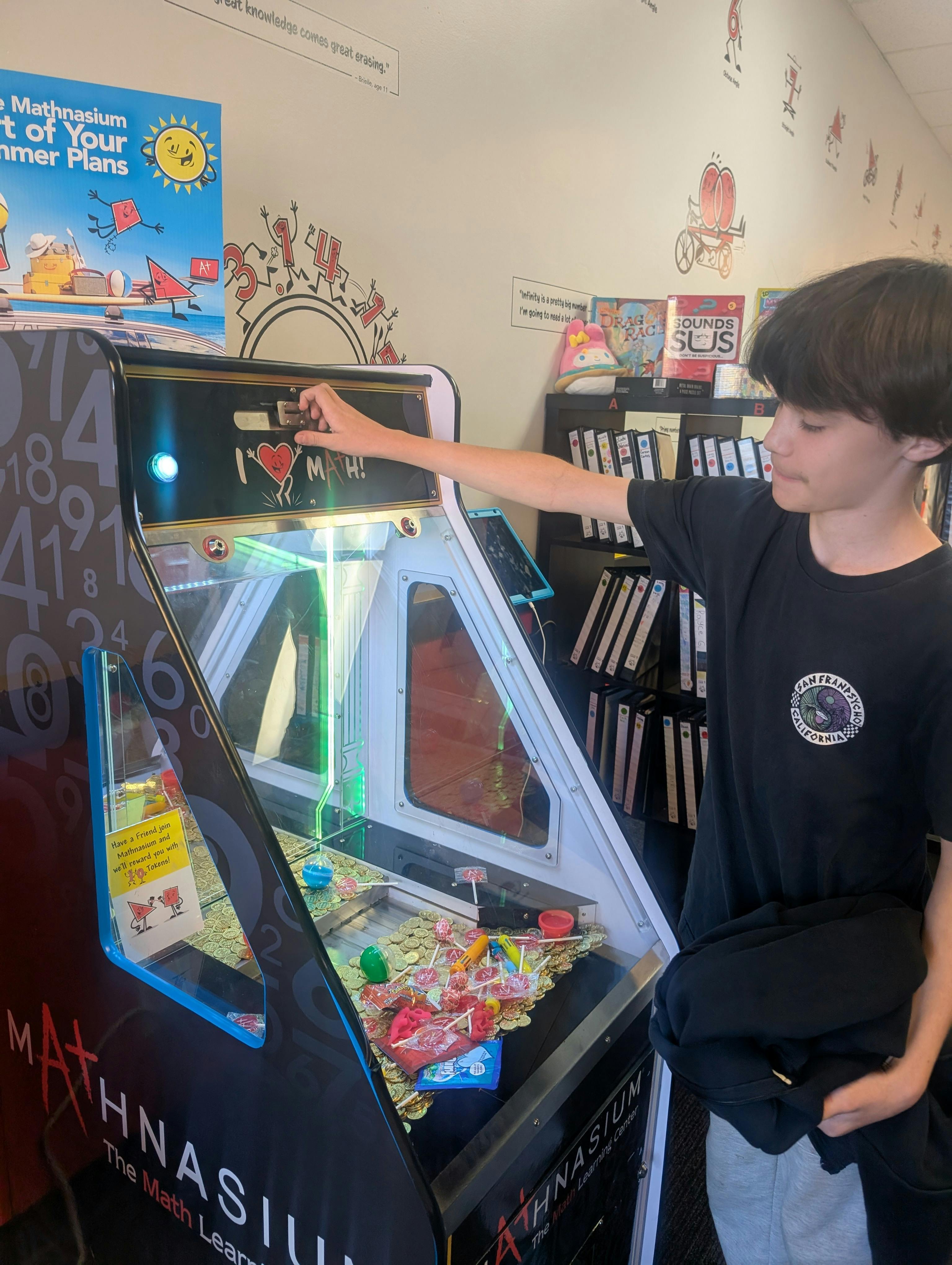 Teen playing an arcade game