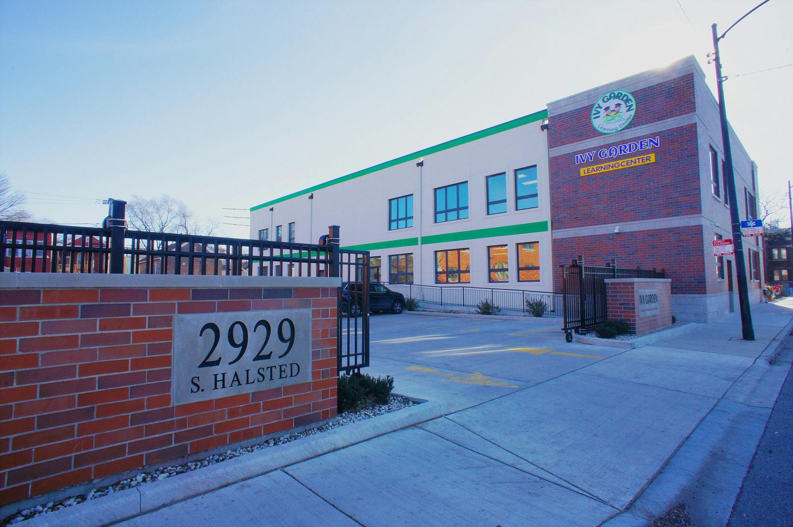 Building with a brick wall sign displaying "2929 S Halsted"