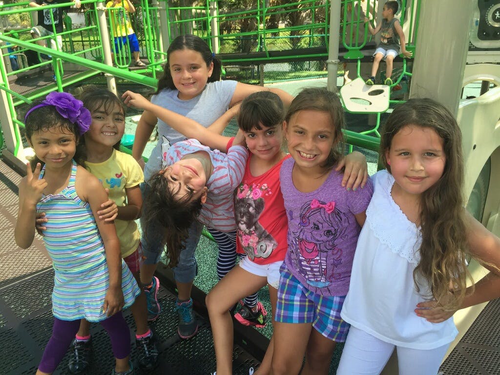 Group of children posing on a playground