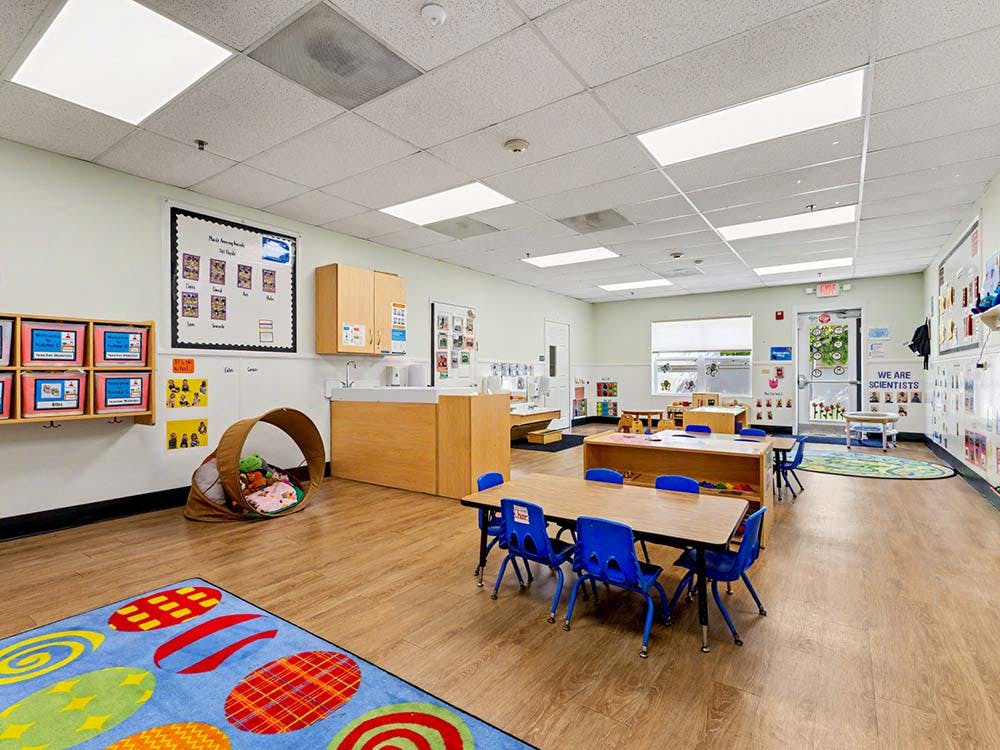 Colorful classroom with child-sized tables and chairs