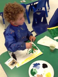 Child painting at a table