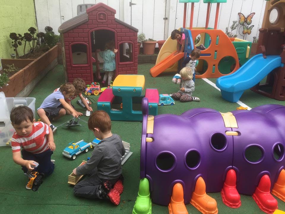 Children playing with toys and playground equipment