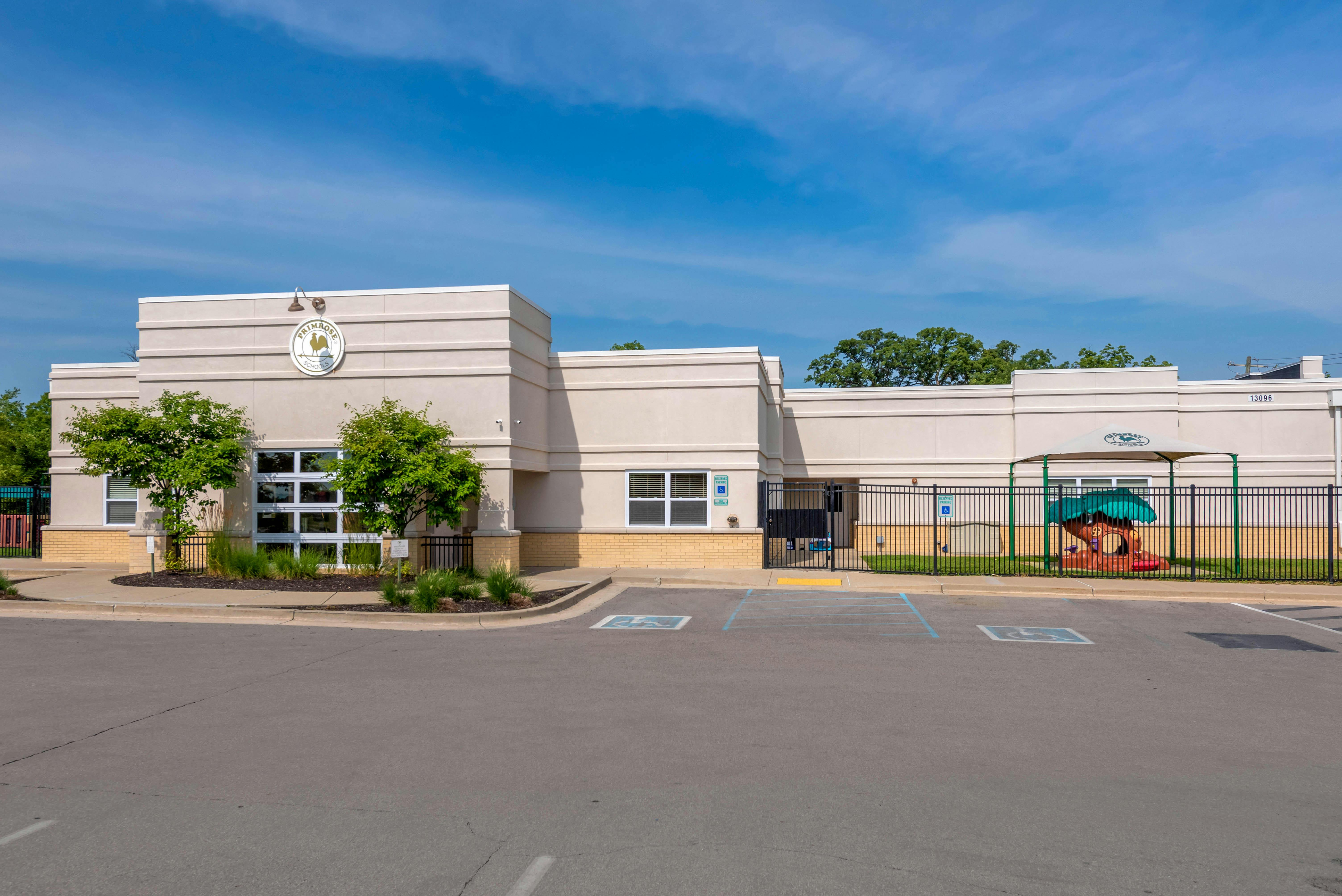 Exterior of a building with a parking lot in front