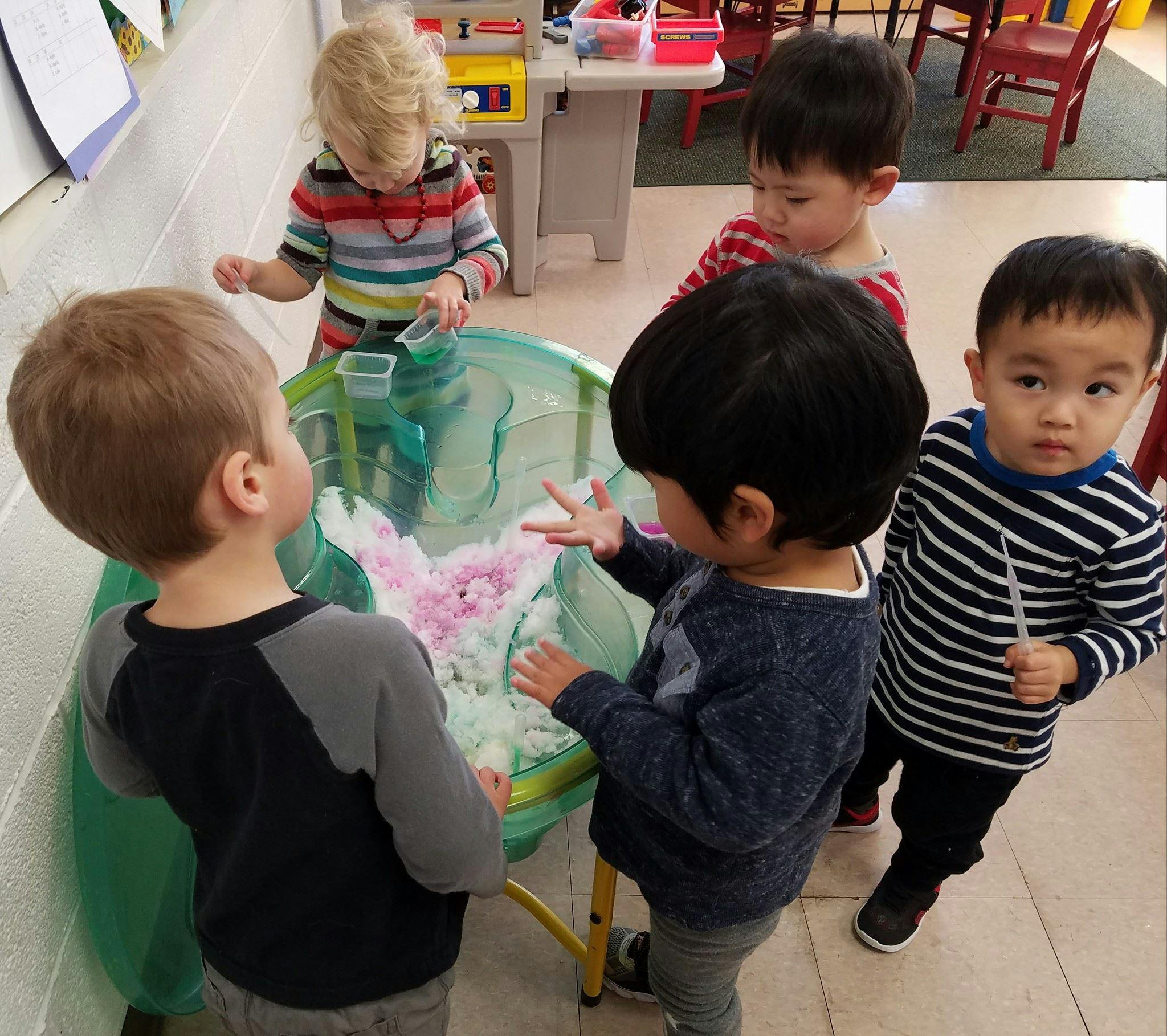 Children playing at a sensory table