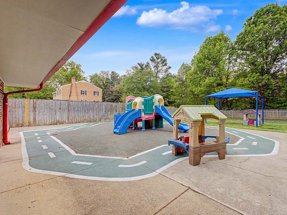 Outdoor playground area with slides and play structures