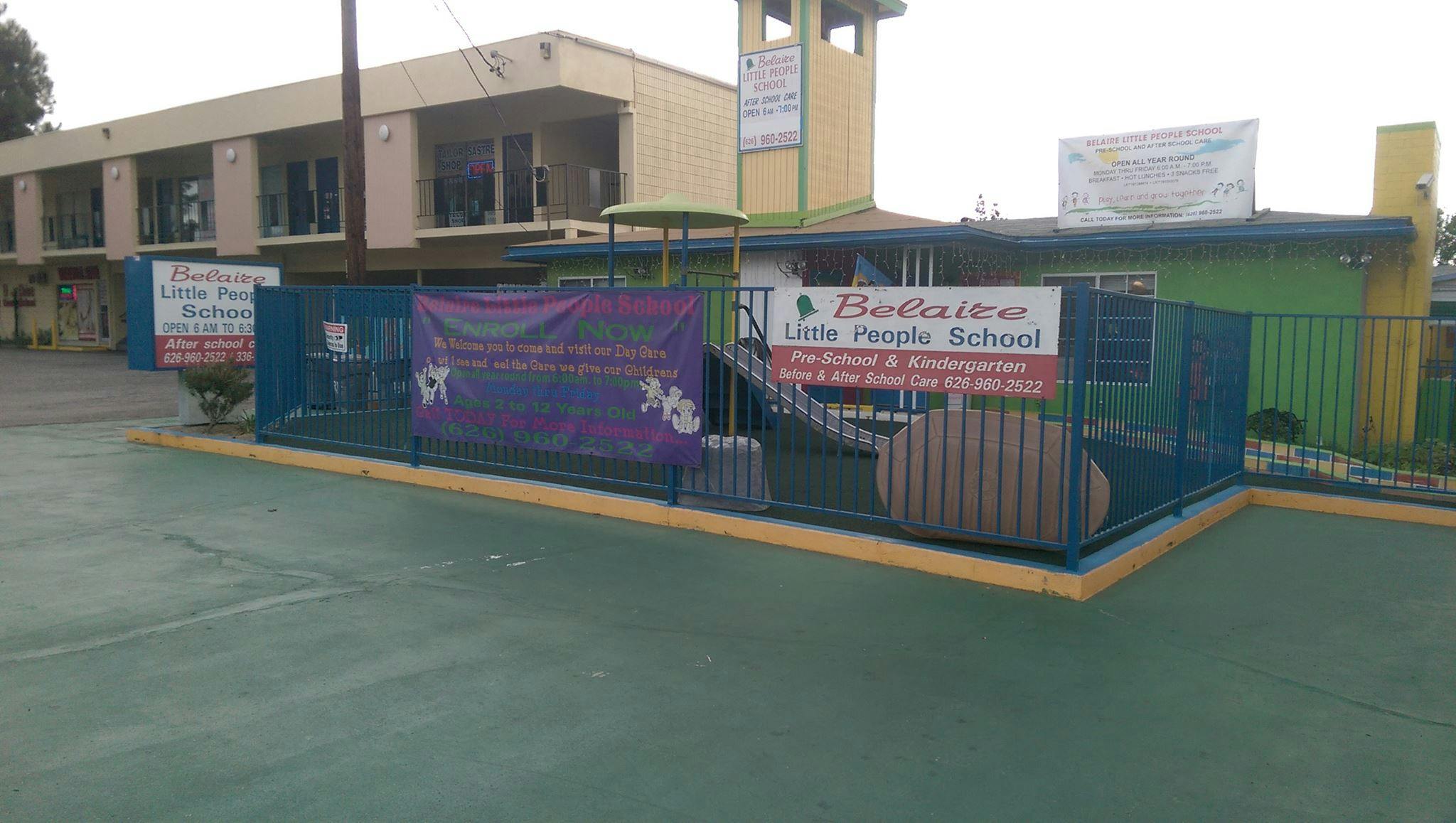 Building exterior with banners on a fence