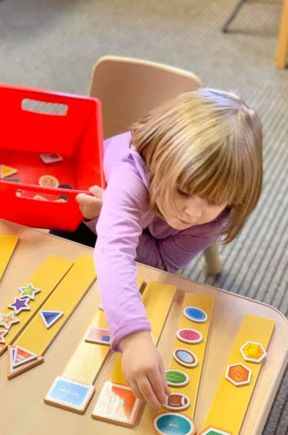 Child playing with shape and object sorting game