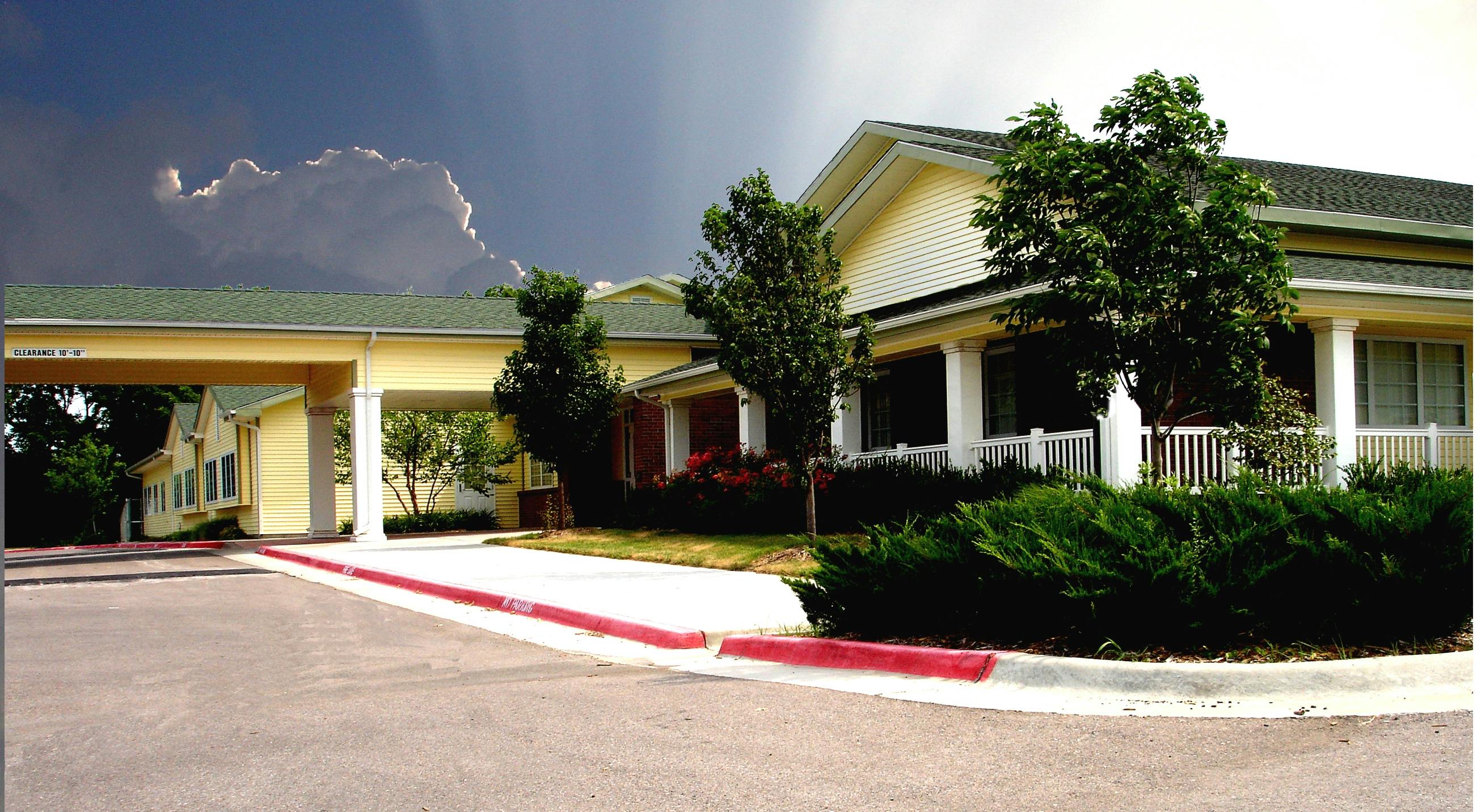 Exterior of a building with a covered driveway entrance