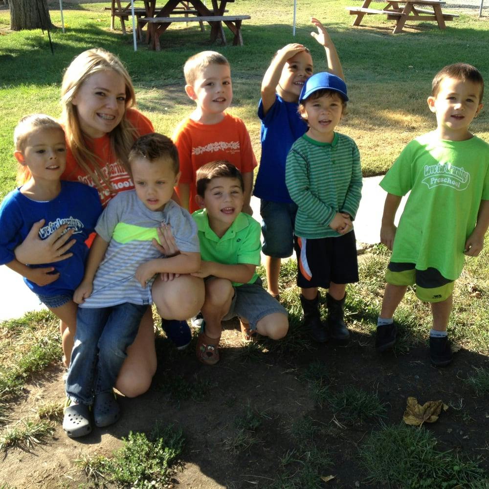 Person with a group of children outdoors