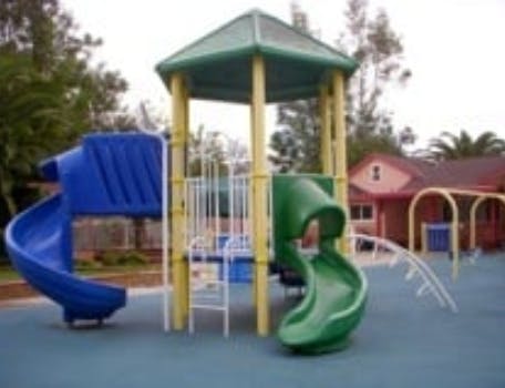 Playground with blue and green slides