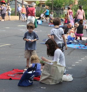 People and children at an outdoor gathering