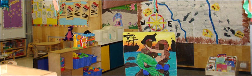 Classroom with children's artwork and storage units