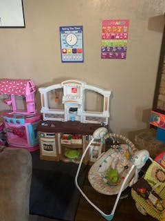 Child's play kitchen and baby swing