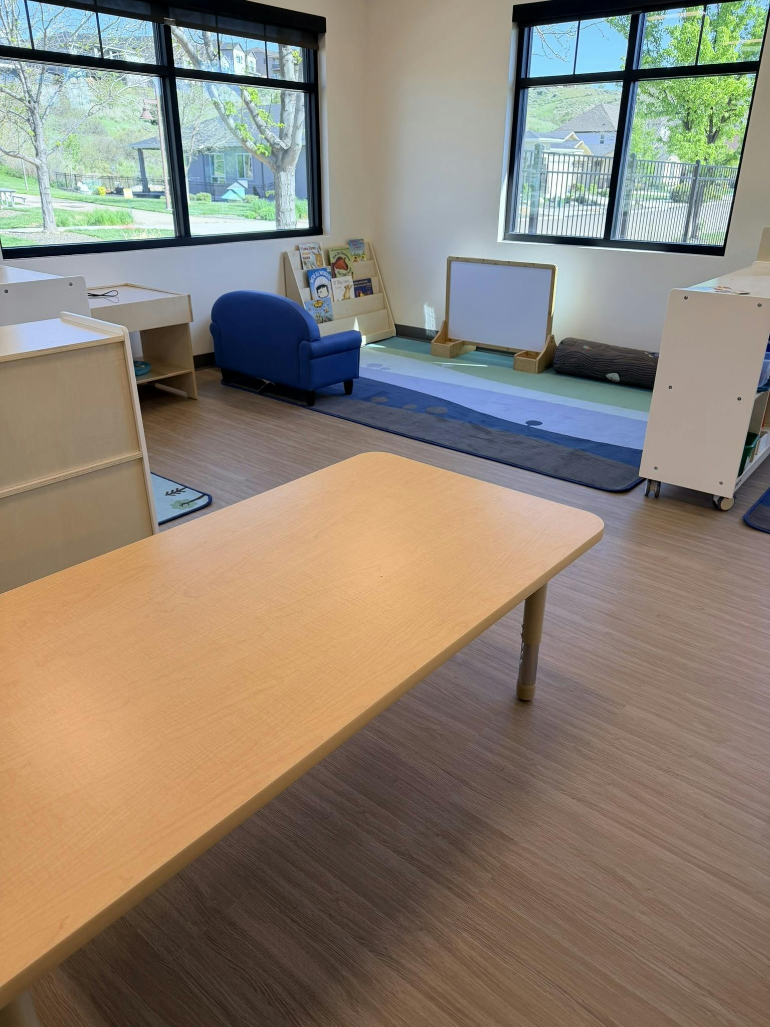 Classroom with child-sized furniture and large windows