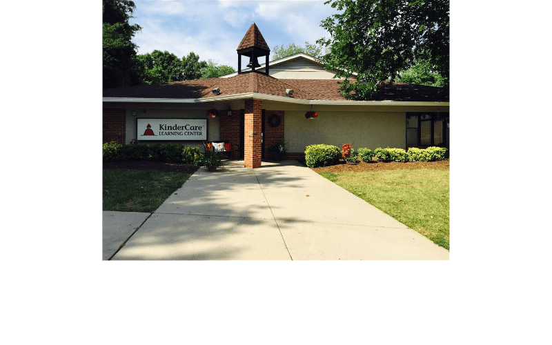 KinderCare Learning Center building with a bell tower