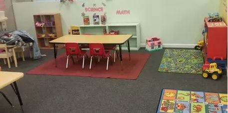 Classroom with tables, chairs, and toys