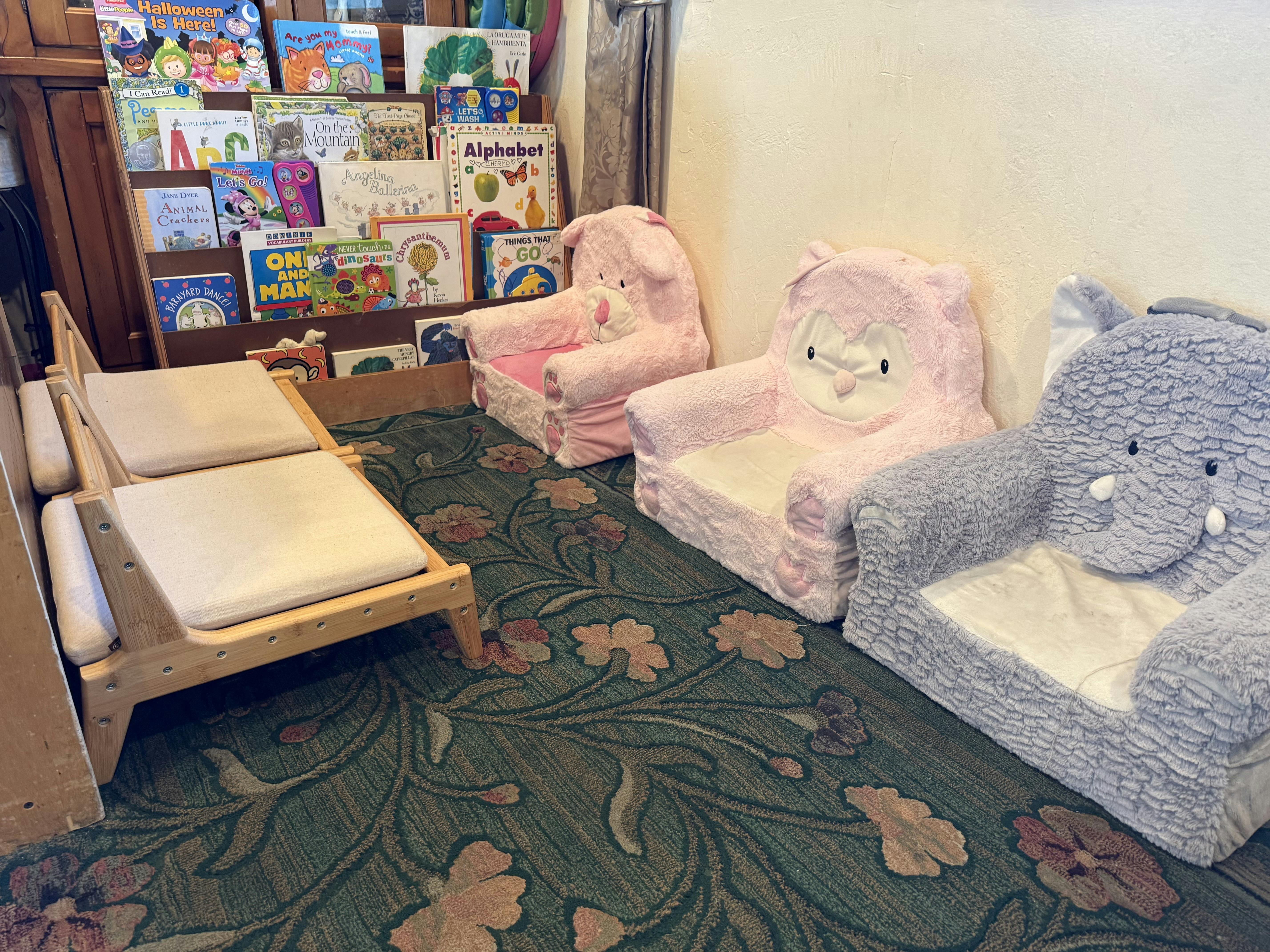 Small chairs and bookshelves for children in a room
