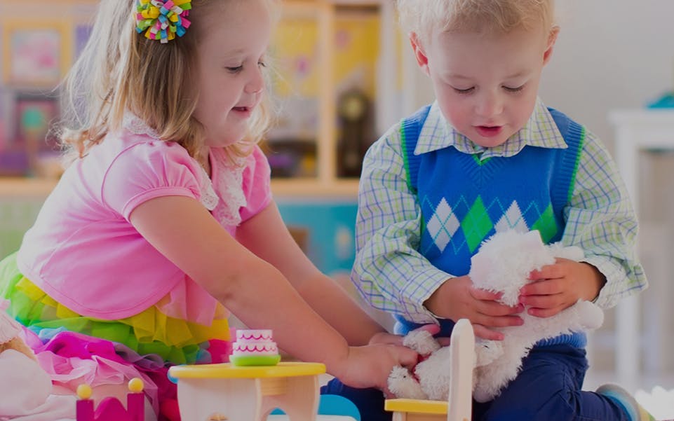 Two children playing with toys