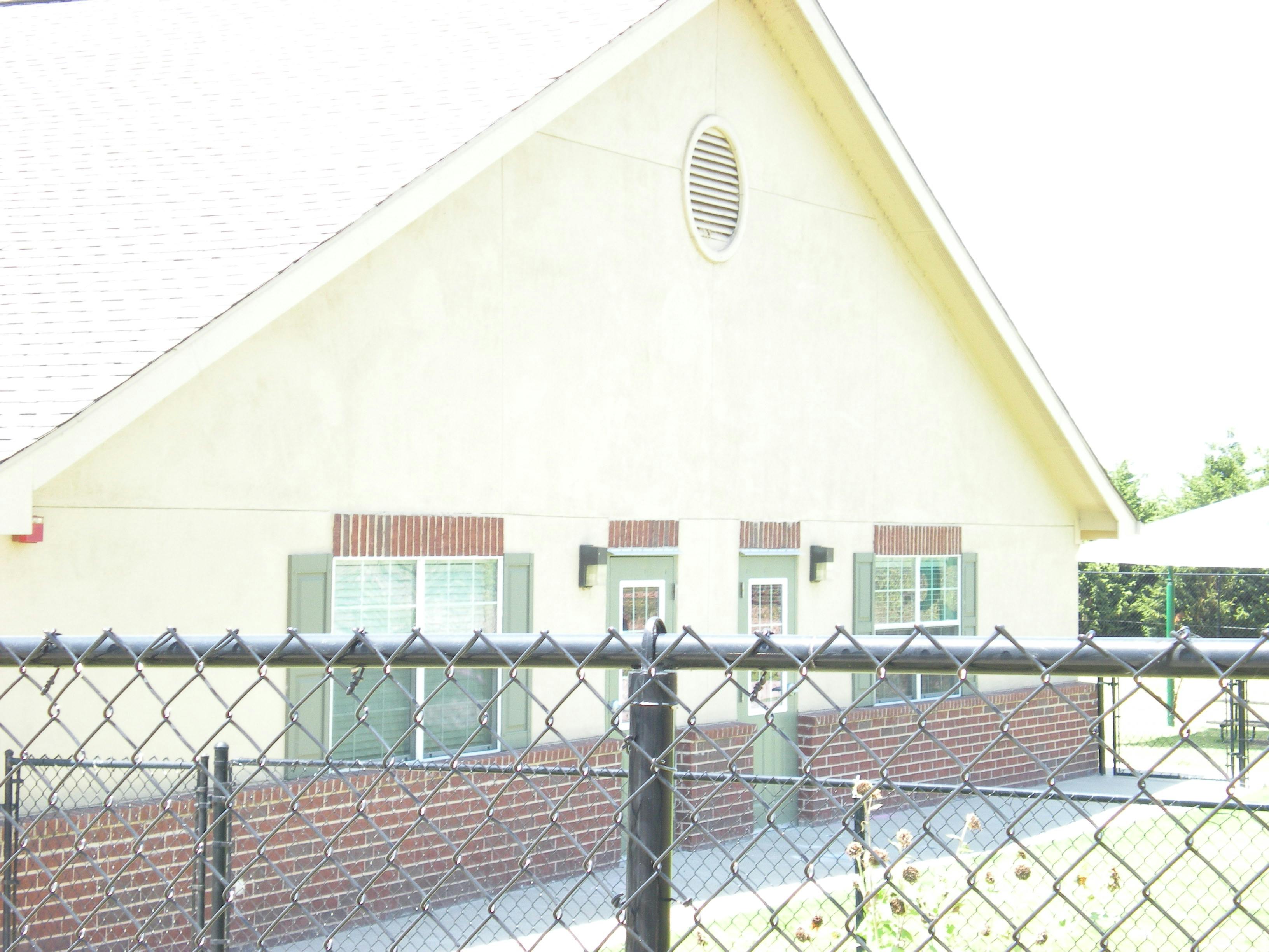 Building with a chain link fence in the foreground