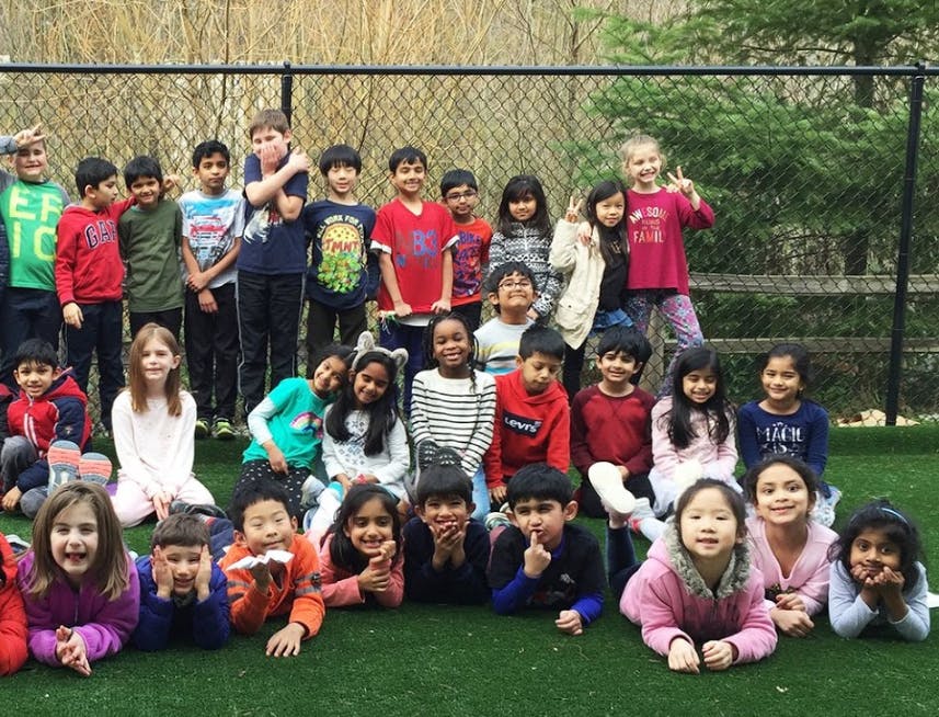 Group of children and teens posing outdoors