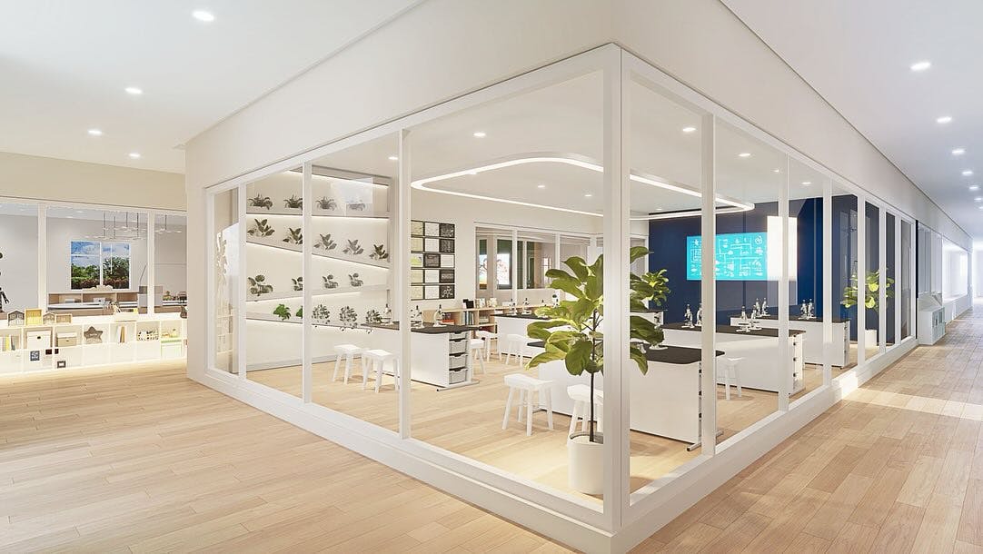 Modern interior hallway with glass-walled rooms
