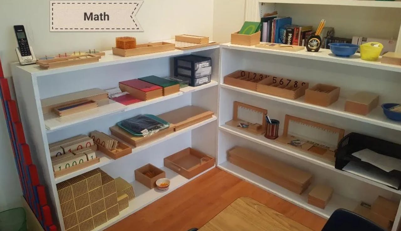 Shelves with various educational materials and a sign that says Math